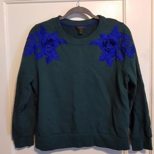 J Crew Forest Green Sweatshirt with blue appliqué flowers